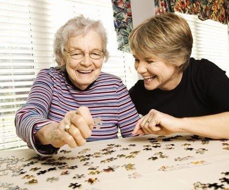 Senior citizen enjoying a puzzle at a Three Rivers area adult day care